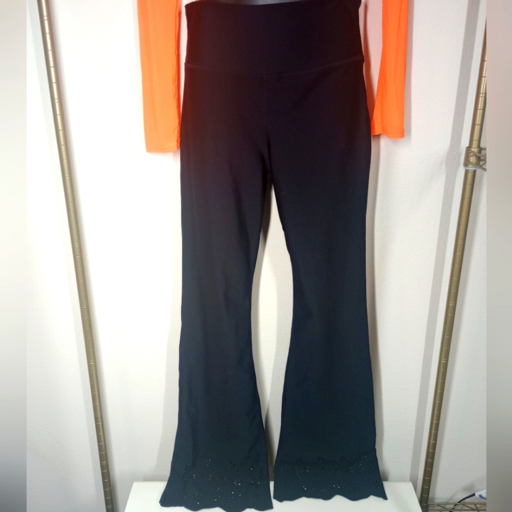 Yoga Pants. Becca. Size: L. Color: Black. Floral Cutout Hemline